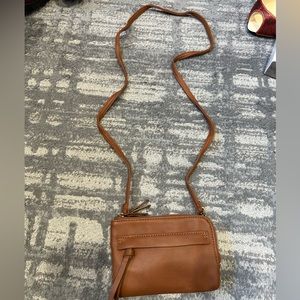 Small Crossbody which is light and has 2 sections for items Excellent condition